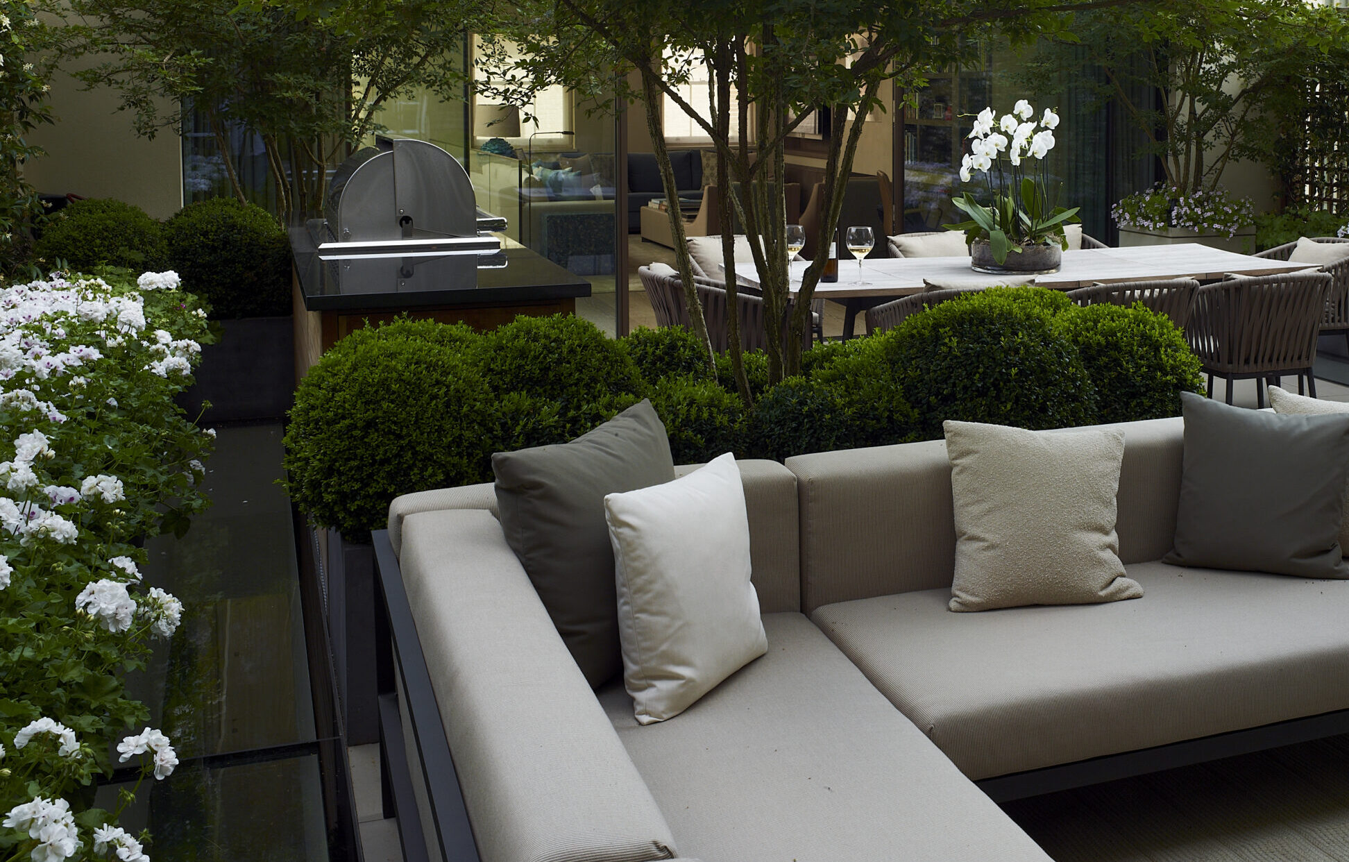 An image of a Chelsea roof top garden terrace, outdoor furniture and neutral tones