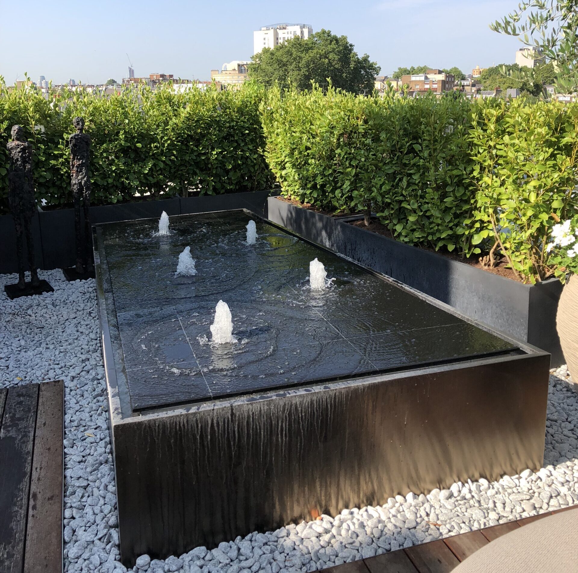 An image of a water feature on a small roof top garden 