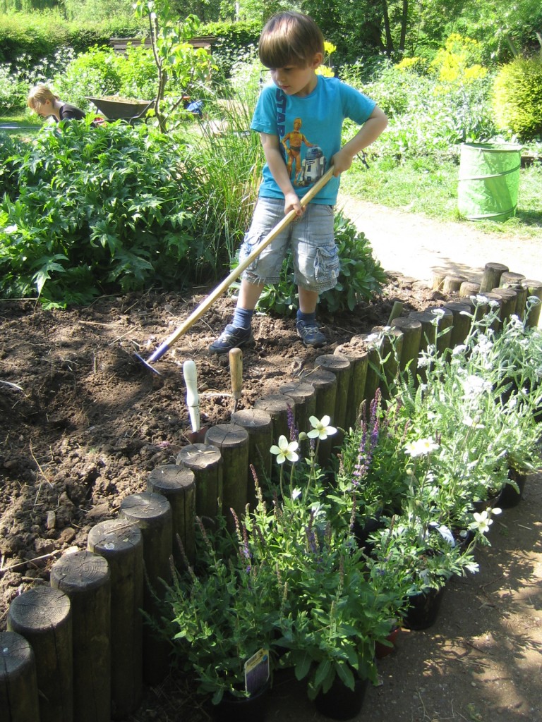 A young volunteer at the Triangle Garden