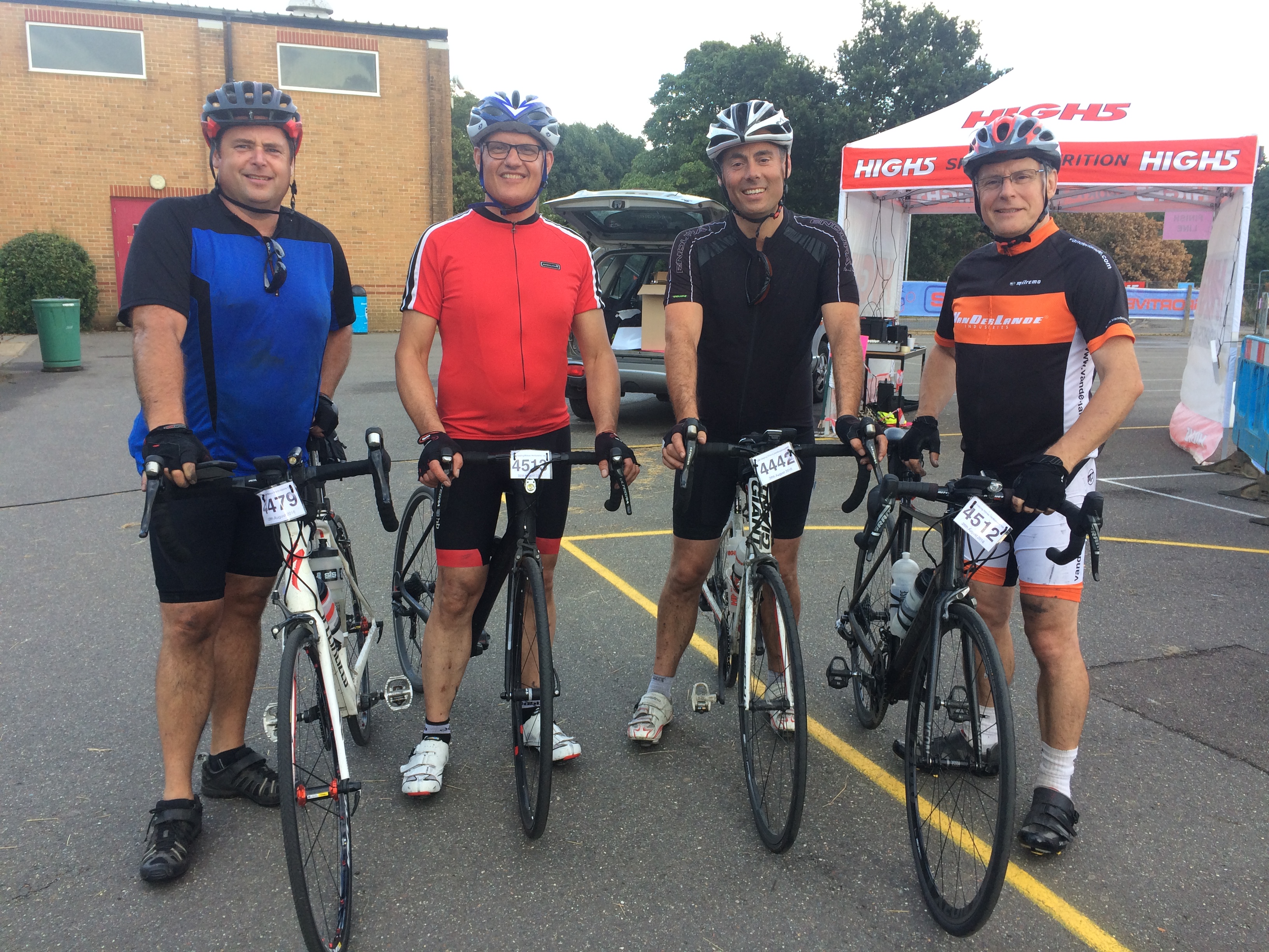 Four happy faces after 107 miles and seven punctures!